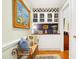 Elegant hallway featuring a built-in bar area with glass and wine storage at 1610 Ridge Rd, Raleigh, NC 27607