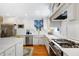 The kitchen boasts stainless steel appliances, ample counter space, and hardwood flooring at 1610 Ridge Rd, Raleigh, NC 27607