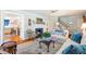 Inviting living room with a fireplace, comfortable sofa, and access to other rooms at 1610 Ridge Rd, Raleigh, NC 27607