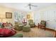 Bright living room showcasing shuttered windows, cozy seating, and a decorative rug at 1610 Ridge Rd, Raleigh, NC 27607