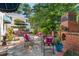 Outdoor kitchen and patio area with built-in grill and ample seating, creating an ideal outdoor gathering space at 1610 Ridge Rd, Raleigh, NC 27607