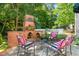 The outdoor kitchen has ample seating, a beautiful brick surround, and is perfect for entertaining guests at 1610 Ridge Rd, Raleigh, NC 27607