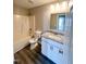 Bathroom features granite countertops, vanity, shower/tub combo, toilet and hardwood flooring at 1618 Brownairs Ln, Raleigh, NC 27610