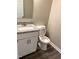 Bathroom featuring granite countertop and modern white vanity at 1618 Brownairs Ln, Raleigh, NC 27610