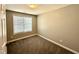 Bedroom with neutral paint, carpet, and window with blind at 1618 Brownairs Ln, Raleigh, NC 27610