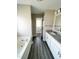 Bathroom featuring a soaking tub, walk-in shower, and modern vanity at 1618 Brownairs Ln, Raleigh, NC 27610