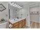 Well-lit bathroom includes a double sink vanity and a large mirror at 1725 T W Alexander Dr # 204, Durham, NC 27703