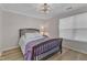 Cozy bedroom features wood flooring, natural light, and modern ceiling fan at 1725 T W Alexander Dr # 204, Durham, NC 27703