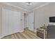 Cozy bedroom with wood floors, a closet, an open doorway, and a modern desk at 1725 T W Alexander Dr # 204, Durham, NC 27703