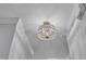Close-up of a modern gold and crystal chandelier in an entryway at 1725 T W Alexander Dr # 204, Durham, NC 27703