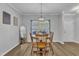 Cozy dining area features hardwood style flooring and a chandelier at 1725 T W Alexander Dr # 204, Durham, NC 27703