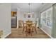 Bright dining area with hardwood style flooring, a chandelier, and natural light at 1725 T W Alexander Dr # 204, Durham, NC 27703