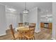 Cozy dining room features wood flooring, round table, and decorative light fixture at 1725 T W Alexander Dr # 204, Durham, NC 27703