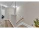 Hallway with wood-look flooring, staircase, and convenient access to the upper level at 1725 T W Alexander Dr # 204, Durham, NC 27703