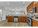 Open kitchen overlooking the living room features stainless steel appliances at 1725 T W Alexander Dr # 204, Durham, NC 27703