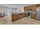 Modern kitchen featuring stainless steel appliances and hardwood style flooring at 1725 T W Alexander Dr # 204, Durham, NC 27703