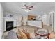 Spacious living room boasts a fireplace, hardwood style flooring, and a ceiling fan at 1725 T W Alexander Dr # 204, Durham, NC 27703
