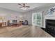 Bright living room featuring a fireplace, ceiling fan and sliding doors to the outdoor space at 1725 T W Alexander Dr # 204, Durham, NC 27703