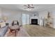 Cozy living room featuring a fireplace, ceiling fan and sliding doors for natural light at 1725 T W Alexander Dr # 204, Durham, NC 27703