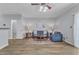 Cozy living room features a ceiling fan, blue sofa, and hardwood style flooring at 1725 T W Alexander Dr # 204, Durham, NC 27703