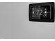 Close-up shot of a modern, smart thermostat mounted on a wall at 1725 T W Alexander Dr # 204, Durham, NC 27703
