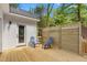 Back deck featuring two Adirondack chairs and a sliding glass door to the home's interior at 1952 Lewis Dr, Burlington, NC 27215