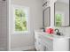 Modern bathroom featuring double sink vanity and a window bringing in natural light at 1952 Lewis Dr, Burlington, NC 27215