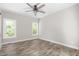 Bright bedroom featuring natural light and wood floors at 1952 Lewis Dr, Burlington, NC 27215