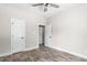 Bedroom featuring luxury vinyl plank flooring and two doors leading to other spaces at 1952 Lewis Dr, Burlington, NC 27215
