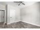 Bedroom featuring luxury vinyl plank flooring, doors leading to other spaces, and a ceiling fan at 1952 Lewis Dr, Burlington, NC 27215