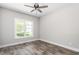 Bright bedroom featuring luxury vinyl plank flooring and a ceiling fan at 1952 Lewis Dr, Burlington, NC 27215
