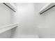 Walk-in closet equipped with shelving and hanging rods for optimal storage at 1952 Lewis Dr, Burlington, NC 27215