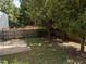 Backyard with a gazebo, furniture, shade trees, and grass in a home listing at 2037 Summer Shire Way, Raleigh, NC 27604