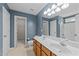 Well-lit bathroom with a double sink vanity, toilet and shower/tub combination at 2037 Summer Shire Way, Raleigh, NC 27604
