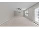 Empty bedroom featuring carpet floors, ceiling fan, and natural light at 2037 Summer Shire Way, Raleigh, NC 27604