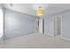 Bedroom with carpet, a ceiling lamp, and two doorways in a home listing at 2037 Summer Shire Way, Raleigh, NC 27604