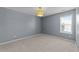 Bedroom with carpet, a window, and a ceiling lamp in a home listing at 2037 Summer Shire Way, Raleigh, NC 27604