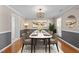 Dining room featuring a modern chandelier and marble table, perfect for entertaining at 2037 Summer Shire Way, Raleigh, NC 27604