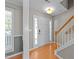 Welcoming entryway with wood floors and staircase leading to the upper level at 2037 Summer Shire Way, Raleigh, NC 27604