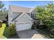 Charming two-story home with a two car garage and mature landscaping at 2037 Summer Shire Way, Raleigh, NC 27604
