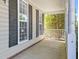 Inviting front porch with columns and large windows at 2037 Summer Shire Way, Raleigh, NC 27604