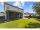 Spacious backyard features a screened porch and patio with a charming stone fire pit, perfect for outdoor relaxation at 209 S Harrison Place Ln, Fuquay Varina, NC 27526