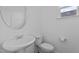 Clean bathroom with a modern sink and toilet, creating a functional space at 209 S Harrison Place Ln, Fuquay Varina, NC 27526
