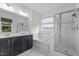 Bathroom featuring soaking tub, glass shower, double vanity, and tile flooring at 209 S Harrison Place Ln, Fuquay Varina, NC 27526