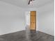 Bedroom with a sliding barn door and modern flooring, creating a cozy space at 209 S Harrison Place Ln, Fuquay Varina, NC 27526