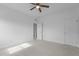 Bedroom featuring large windows, neutral carpet, and closet at 209 S Harrison Place Ln, Fuquay Varina, NC 27526