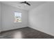 Bedroom featuring wood-look flooring and a bright window, providing a comfortable space at 209 S Harrison Place Ln, Fuquay Varina, NC 27526