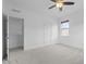 Bedroom featuring a large closet and plush carpeting throughout the space at 209 S Harrison Place Ln, Fuquay Varina, NC 27526