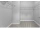 Walk-in closet with carpet flooring and wire shelving at 209 S Harrison Place Ln, Fuquay Varina, NC 27526