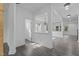 Bright, open-concept living space with modern flooring and a view into the kitchen at 209 S Harrison Place Ln, Fuquay Varina, NC 27526